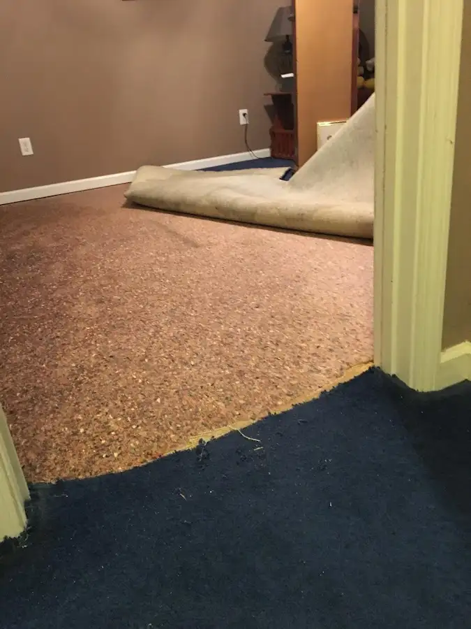 Carpet pad removal revealing water damage during Drying & Dehumidification in Polson